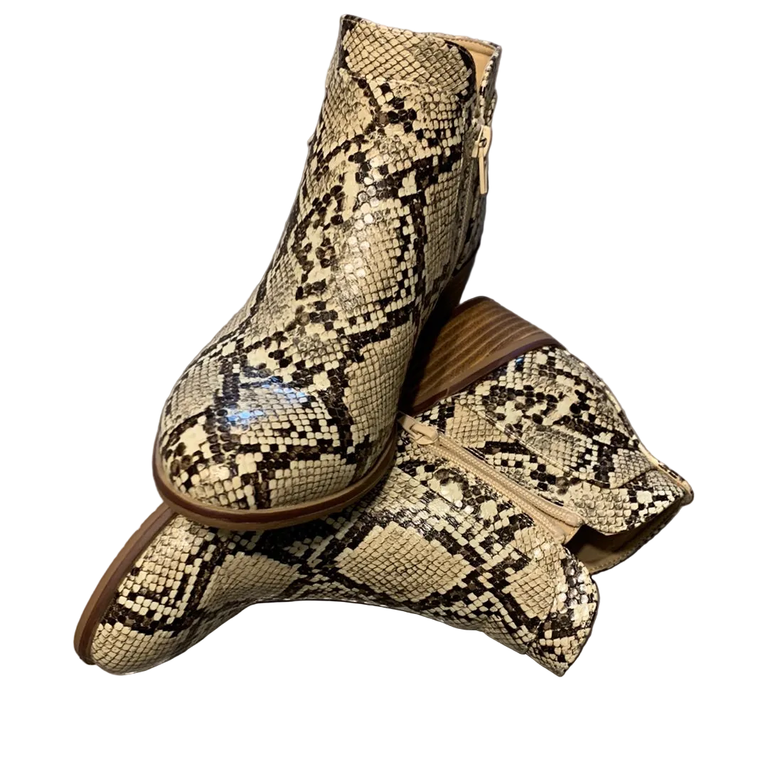 A pair of snakeskin-look boots with zippers on the sides.